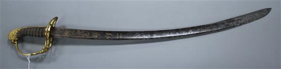 A Georgian infantry officers sword, fine gilt hilt, the curved blade gilt etched with GR and Royal Arms, blade 73.5cm, overall length